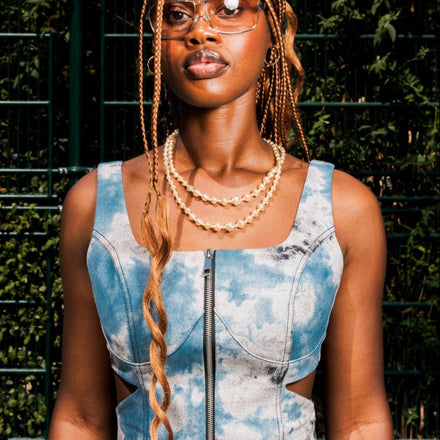 Blue tie-dye corset top in 100% cotton with side cut-outs and front zip closure by UNFOLLOWORLD.