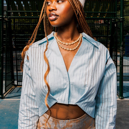 Light blue Sheer Stripes Shirt with transparent stripe detailing, shoulder cut-outs and curved cropped front by UNFOLLOWORLD.