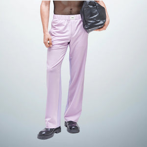 Model, 185 cm (6'0") tall, wearing size 38 TOMMAZO JOVE Pants Lilac, showcasing their sleek and comfortable design as part of the UNFOLLOWORLD collection. 